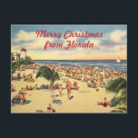 Postal Festiva Vintage Christmas Florida Beach Greeting<br><div class="desc">Escena de la playa de la Florida vintage con texto personalizado: Feliz Navidad desde Florida o edita las palabras que elijas. Antiguo ilustracion de postal antiguo con mucha gente en la playa,  palmeras,  un faro y una velera,  que sirve de telón de fondo para un buen saludo de vacaciones.</div>