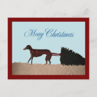 Galgo tirando un árbol de Navidad a través de la n