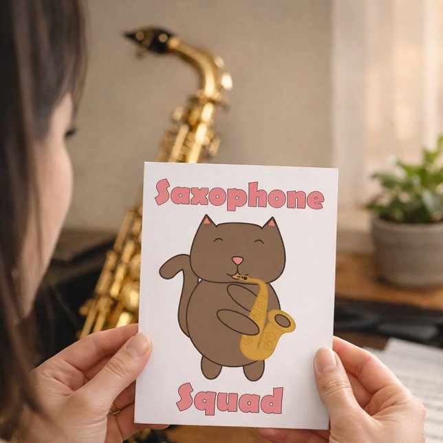 Postal Gato Adorable Tocando Saxofón “Saxophone Squad” Mú (A postcard with a cat playing the saxophone and the words saxophone squad.)