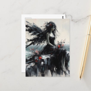 Postal Hada con vestido negro sentado en un acantilado co