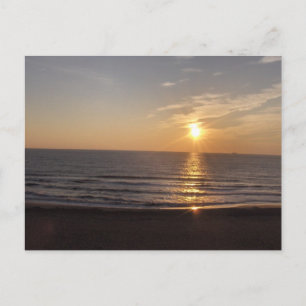 Postal La playa al atardecer