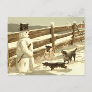 Postal Los perros conocen al muñeco de nieve junto a la c