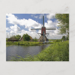 Postal Molino de viento en un canal al este de Leiden en