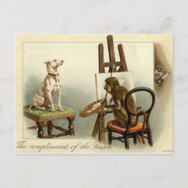 Postal Mono pinta una carta de Navidades de perro