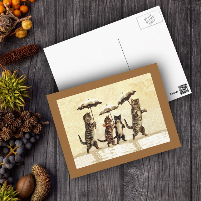 Postal Nieve de paraguas salvajes gatos (Four cats walking upright with umbrellas in snow on yellow with brown border postcard.)