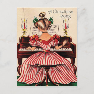 Postal Niña está tocando canción de Navidad en el piano,