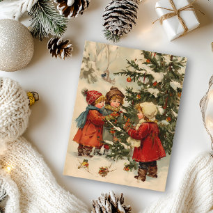 Postal Niños de Navidad de época alrededor de un árbol