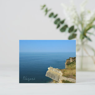 Postal Océano tranquilo en Nazaré, Portugal