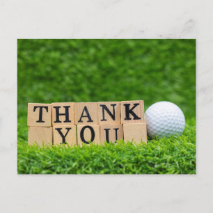 Postal Pelota de golf con la palabra gracias sobre hierba