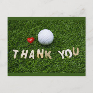 Postal Pelota de golf con la palabra gracias sobre hierba