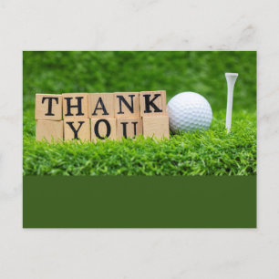 Postal Pelota de golf con la palabra gracias sobre hierba