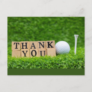Postal Pelota de golf con la palabra gracias sobre hierba