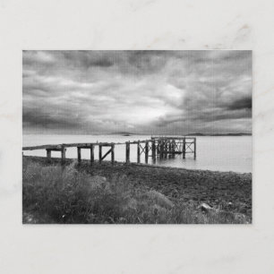 Postal Pier antiguo en la playa de arena plateada de Aber