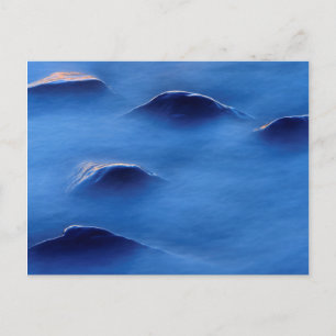 Postal Puesta de sol sobre rocas que sobresalen a través