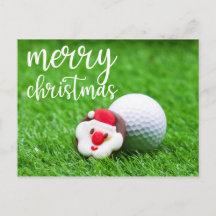 Santa Claus Face con una pelota de golf en verde