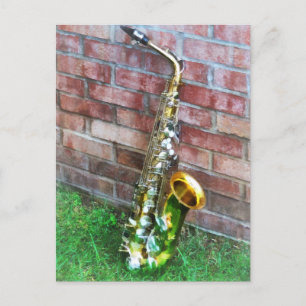 Postal Saxofón contra ladrillo