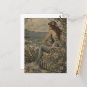 Postal Sirena en una silla vintage junto al mar