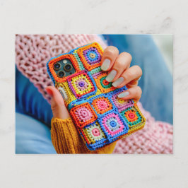 Postal Teen Holding a Crocheted Phone Case Made From Gran