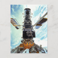 Telescopio espacial Hubble y astronautas