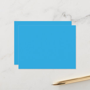 Postal un fondo azul con un gato blanco y negro