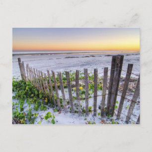 Postal Una cerca de playa al atardecer