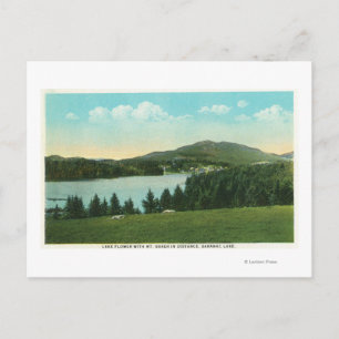 Postal Vista de la flor del lago con el Monte Baker a dis