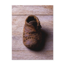 Zapato de bebé de cuero antiguo, historia hecha a