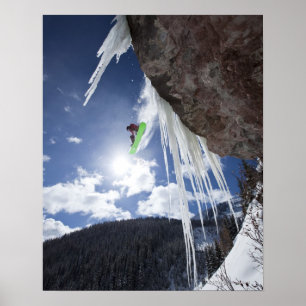 Póster A male snowboarder jumps off an ice waterfall