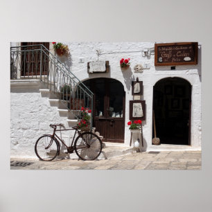 Póster Bici vieja y fachada de tienda en Apulia