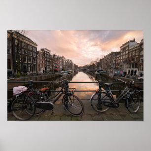 Póster Bicycles at sunset in Amsterdam