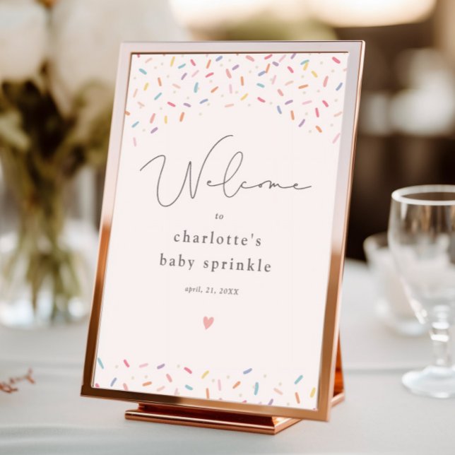 Póster Bienvenidos a Baby Shower con los rociados de arco (Cute rainbow sprinkle baby shower welcome sign.)