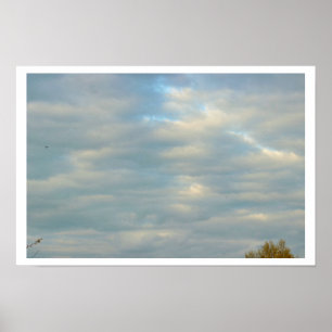 Póster de luz solar asomando a través de las nubes