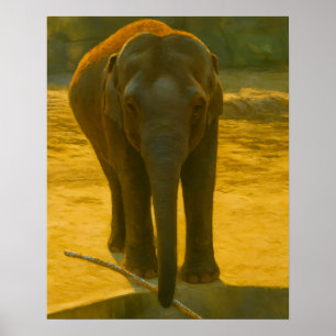 Póster Elefante con rama al borde del agua