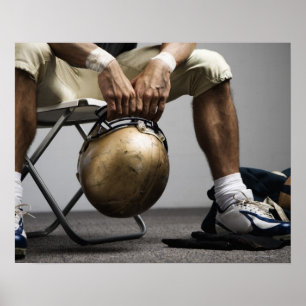 Póster Football player sitting in locker room