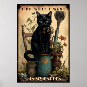 Póster Gato negro sentado en el jardín