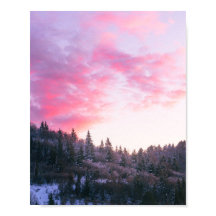 Magical bright pink sunset above snowy forest