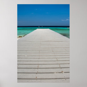 Póster Muelle blanco, playa de arena, océano azul