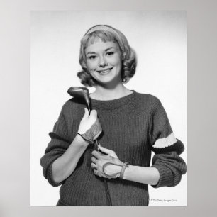 Póster Mujer que detiene al club de golf