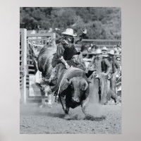 Rider hanging on to bucking bull