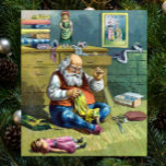 Póster Vintage Christmas, Santa Claus haciendo muñecas de<br><div class="desc">Diseño de las vacaciones de ilustracion Vintage Feliz Navidad con una página del libro Santa Claus y Sus Obras. Publicado por McLoughlin Brothers en 1889. La historia nos cuenta del trabajo de Santa haciendo juguetes para todos los niños y chicas buenos del mundo. Esta imagen de la era victoriana muestra...</div>