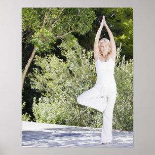 Póster Woman doing yoga on patio