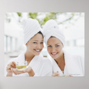 Póster Women in bathrobes drinking tea at spa