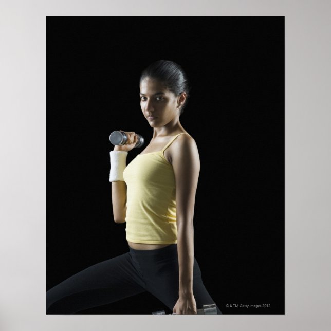 Póster Young woman exercising with dumbbells (Frente)