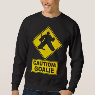 Precaución: Suéter del portero del hockey