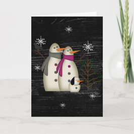 Primitiva pareja de nieve con tarjeta de Navidades