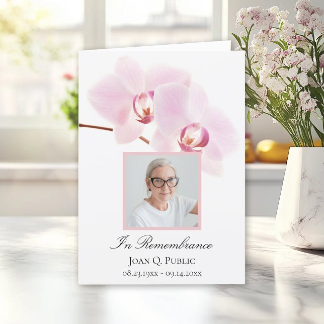 Programa Flor de orquídea rosa sobre funeral blanco plegado (Subido por el creador)