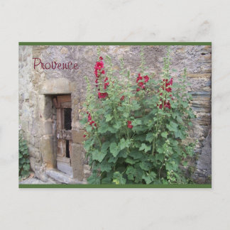 Puerta vieja con el honeysuccle rojo, postal de