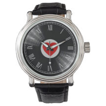 Reloj con disco de vinilo y elementos musicales