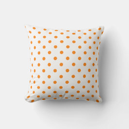 Punto de Polka blanco y naranja en una almohada