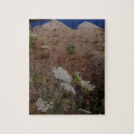 Puzzle Agua tranquila con orilla de flores silvestres